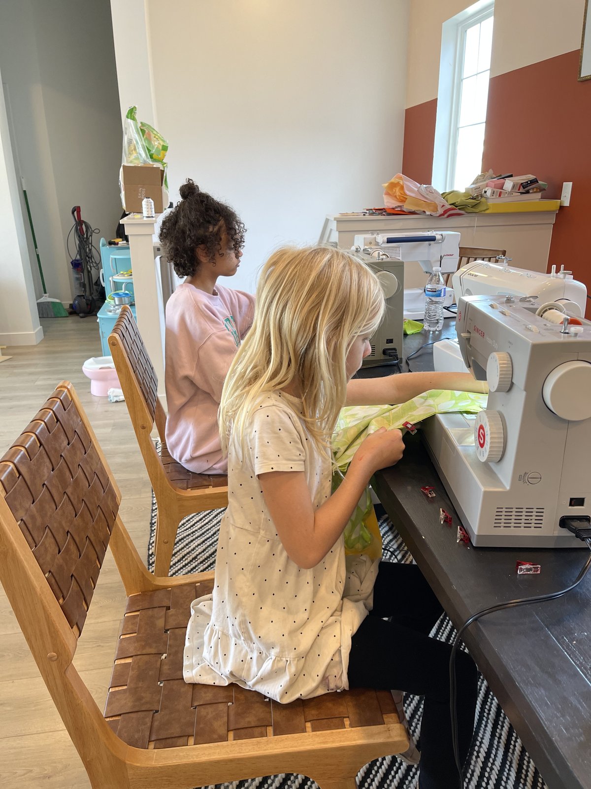 Kids proudly showing off their handmade tote bags at Place of Make